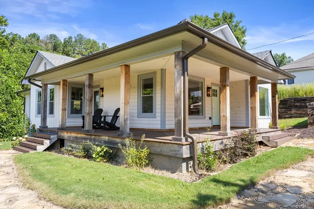 a front view of a house with garden
