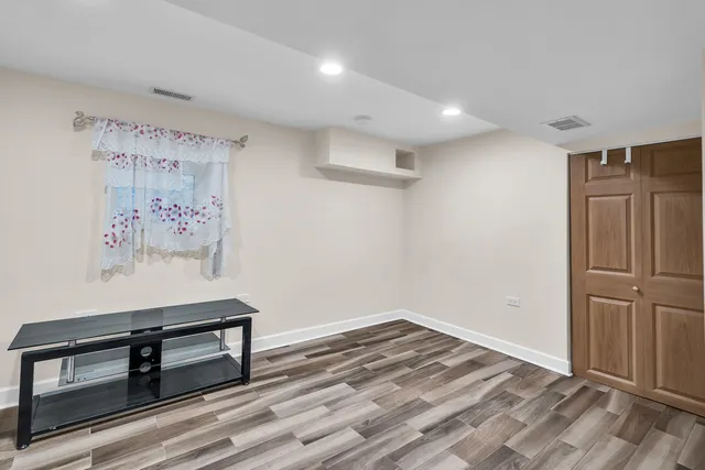 a view of kitchen with furniture and refrigerator