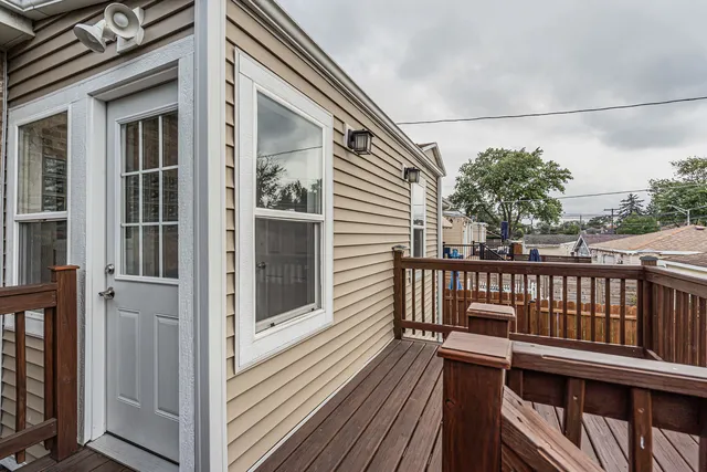 a view of balcony with wooden floor