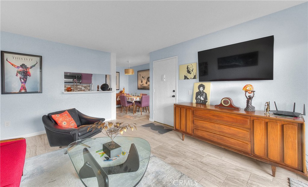 6351 Riverside Drive, Unit 69 Chino, CA 91710 - Photo 3 of 21 a living room with furniture and a flat screen tv