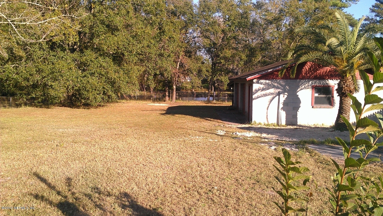 10587 Villanova Road Jacksonville, FL 32218 - Photo 3 of 13 a view of empty space and a yard
