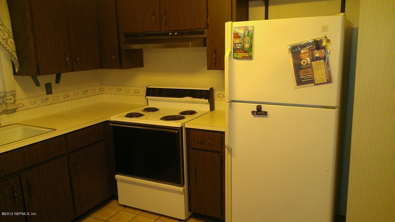 10587 Villanova Road Jacksonville, FL 32218 - Photo 9 of 13 a utility room with dryer and washer