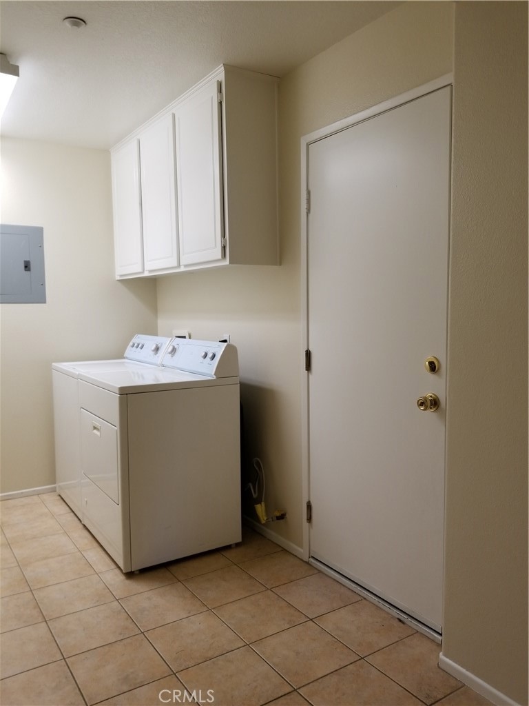 26 Daffodil Irvine, CA 92618 - Photo 14 of 16 a utility room with cabinets washer and dryer