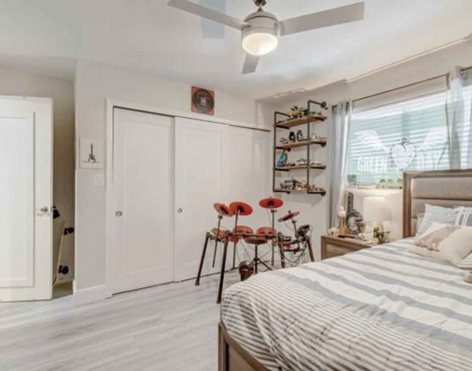 55 Southeast 14th Street, Unit 207 Boca Raton, FL 33432 - Photo 7 of 9 a bed room with a bed and a chair