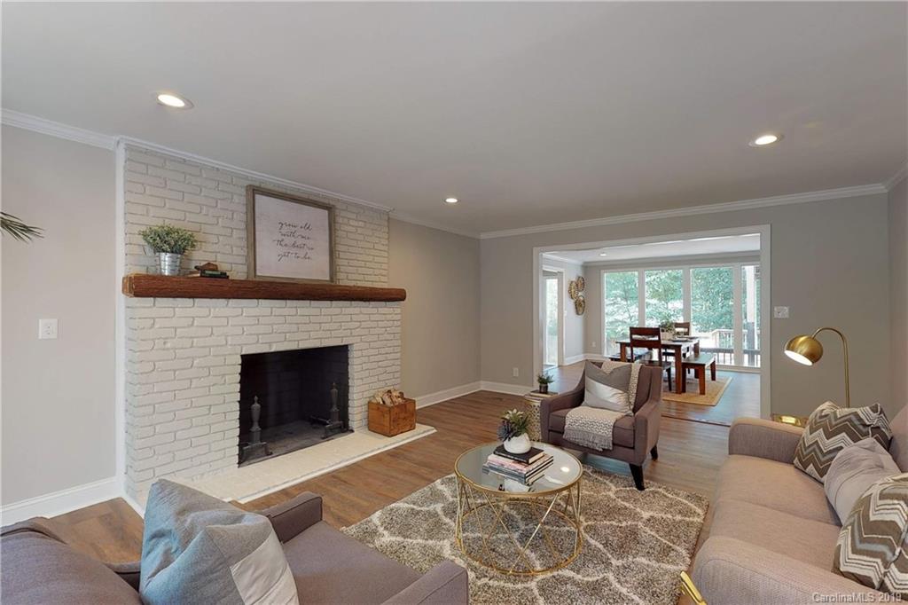 3811 High Ridge Road Charlotte, NC 28270 - Photo 14 of 35 a living room with furniture and a fireplace