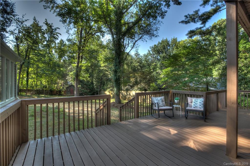 3811 High Ridge Road Charlotte, NC 28270 - Photo 33 of 35 a view of house with deck outdoor seating and covered with trees in the background