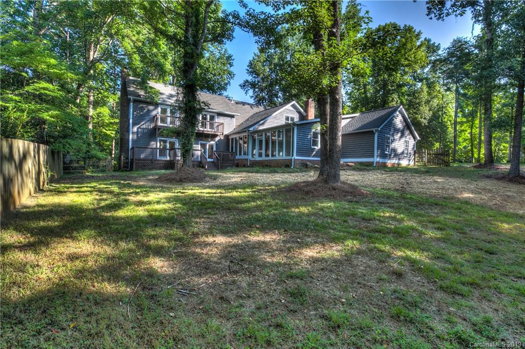 3811 High Ridge Road Charlotte, NC 28270 - Photo 34 of 35 a view of a house with a big yard and large tree
