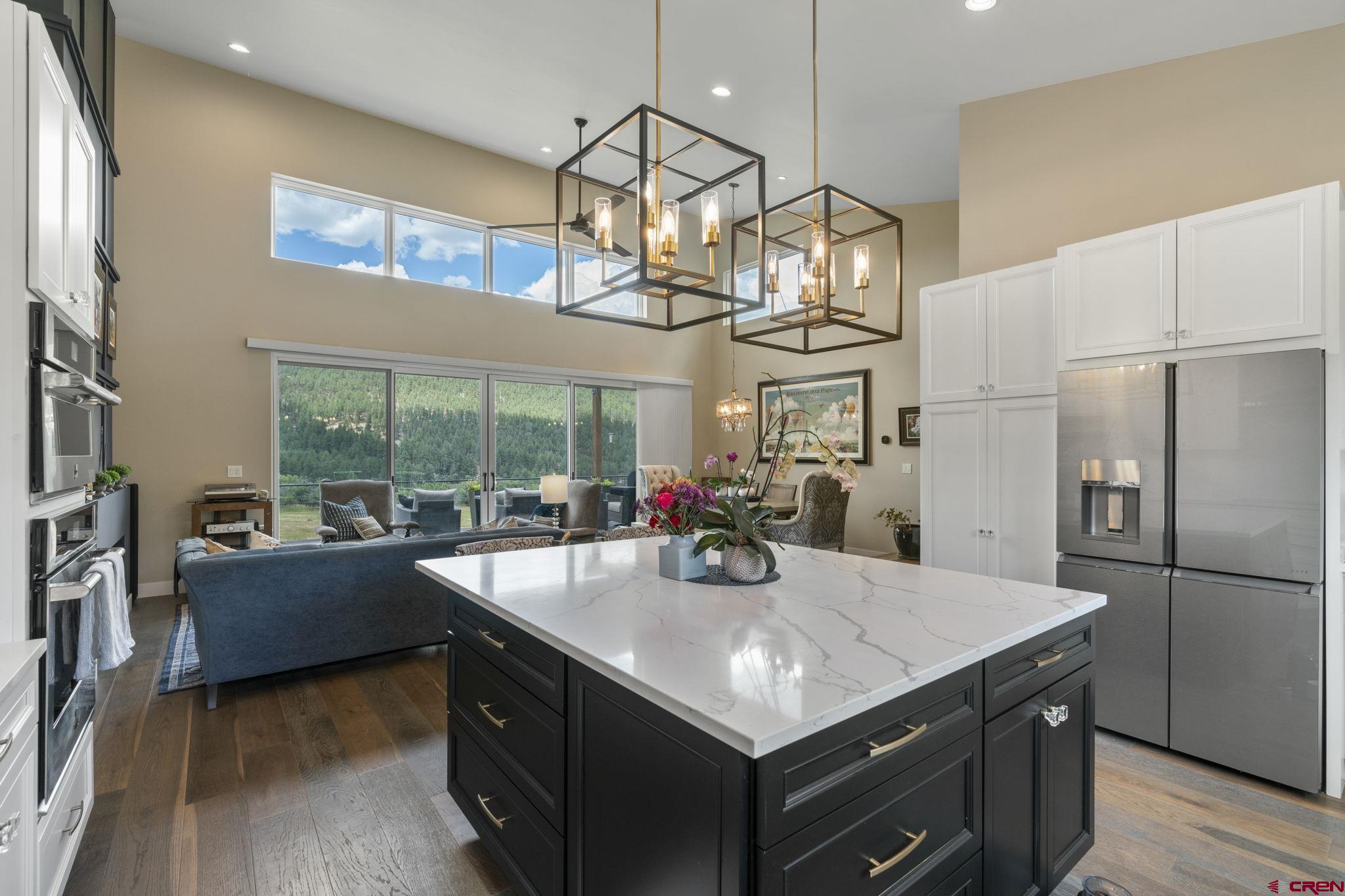 1212 Sunrise Lane Durango, CO 81301 - Photo 1 of 35 a kitchen with a table chairs stainless steel appliances and cabinets
