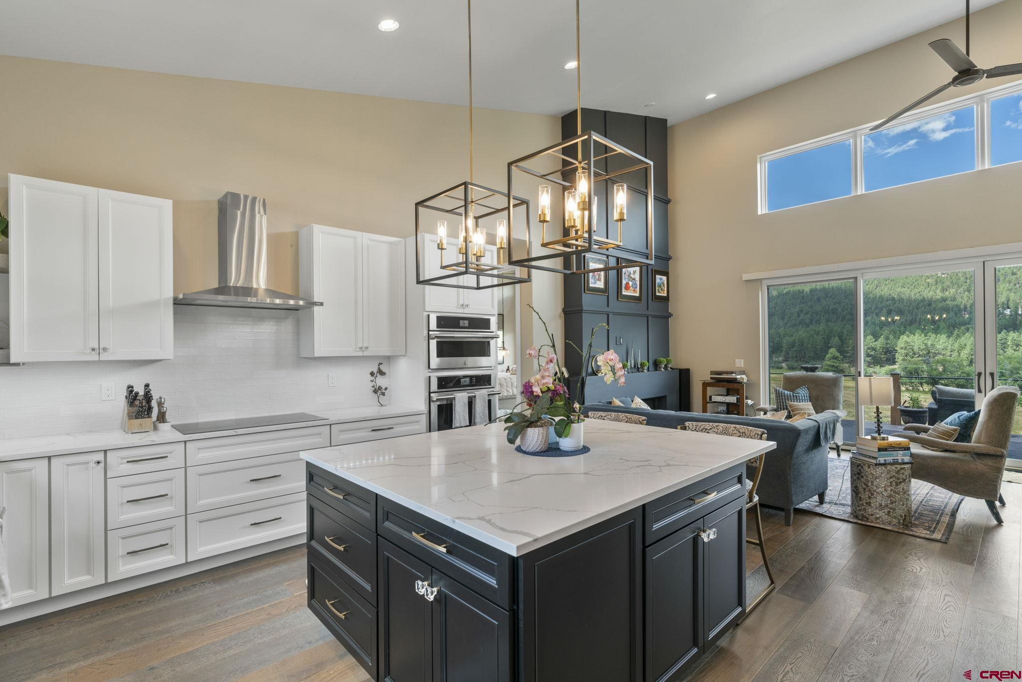 1212 Sunrise Lane Durango, CO 81301 - Photo 13 of 35 a kitchen with a stove and a refrigerator