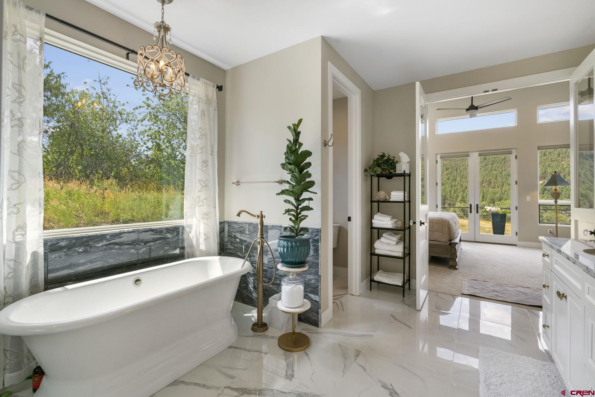 1212 Sunrise Lane Durango, CO 81301 - Photo 17 of 35 a bathroom with a bathtub and a shower