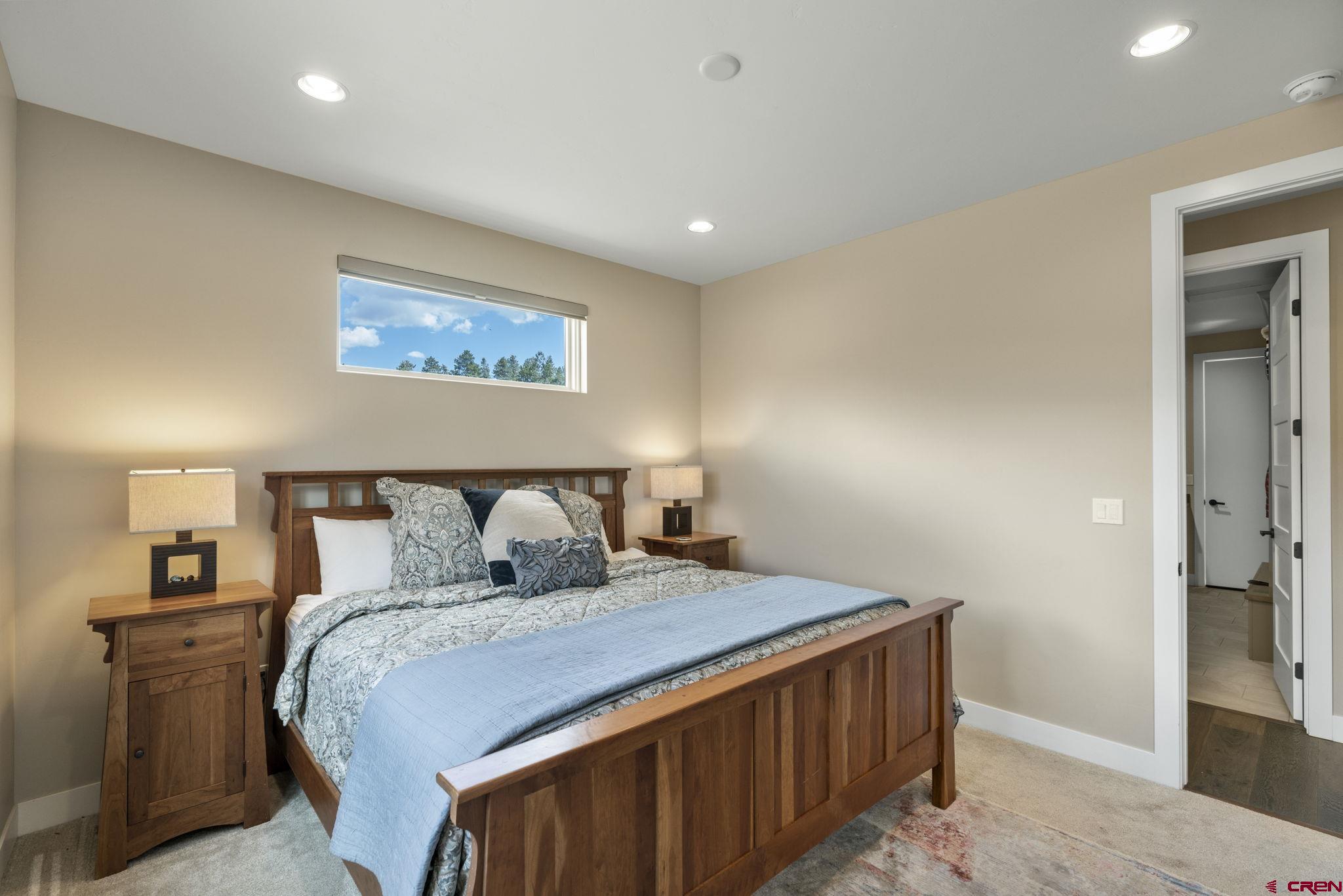 1212 Sunrise Lane Durango, CO 81301 - Photo 20 of 35 a bed sitting in a bedroom and night stand