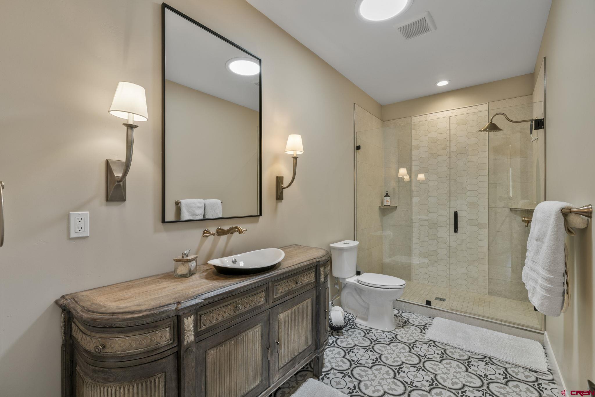 1212 Sunrise Lane Durango, CO 81301 - Photo 22 of 35 a bathroom with a sink toilet and shower