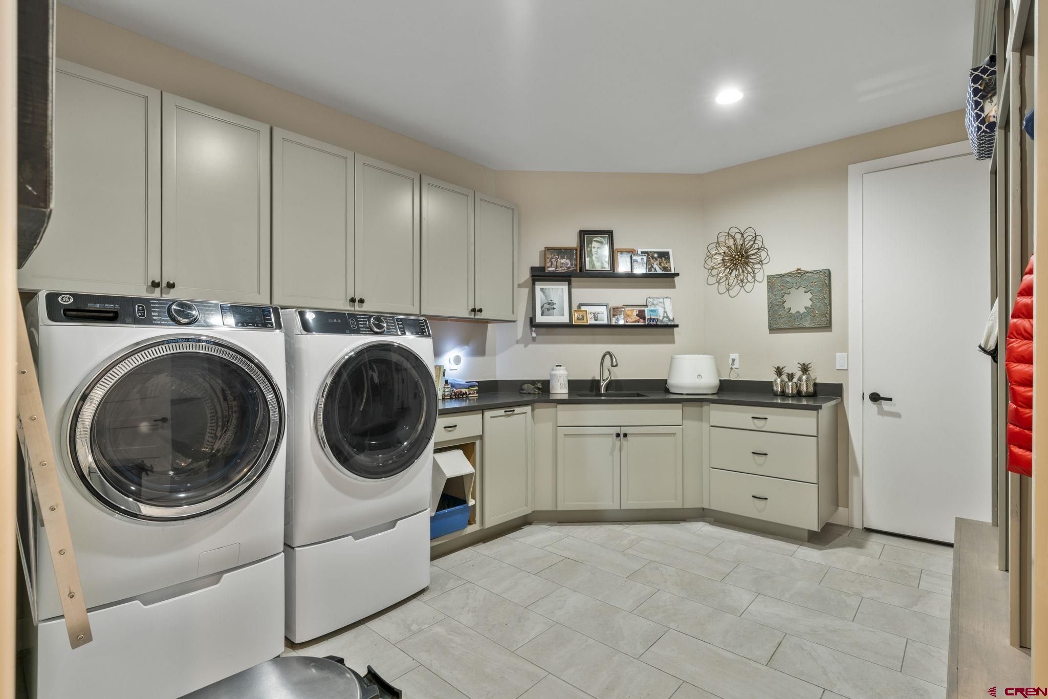 1212 Sunrise Lane Durango, CO 81301 - Photo 26 of 35 a utility room with sink dryer and washer