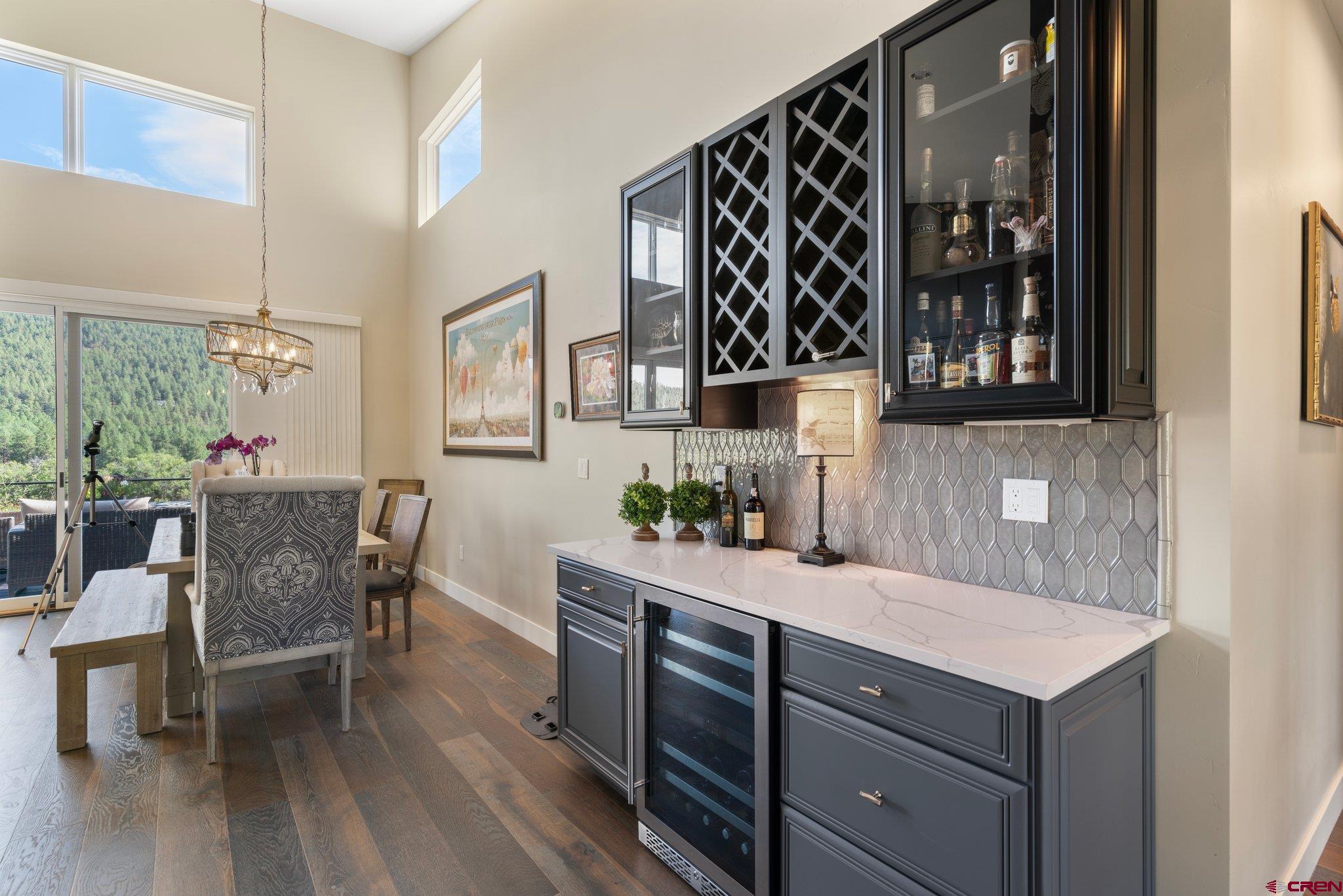 1212 Sunrise Lane Durango, CO 81301 - Photo 5 of 35 a kitchen with a cabinets and chairs