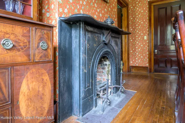 a view of a entryway door with wooden floor