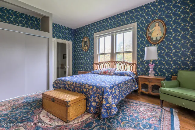 a bedroom with bed and window