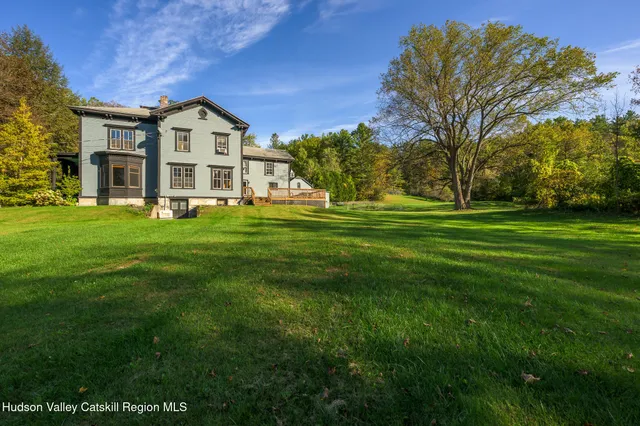 a view of a porch and garden