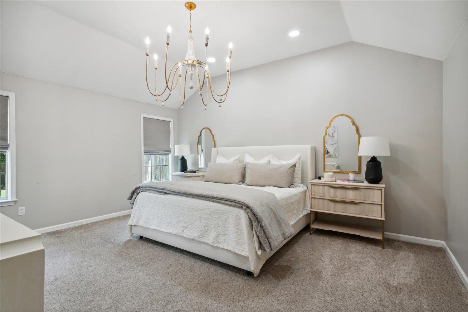 1423 Howling Drive Collierville, TN 38017 - Photo 17 of 28 Carpeted bedroom with vaulted ceiling and an inviting chandelier