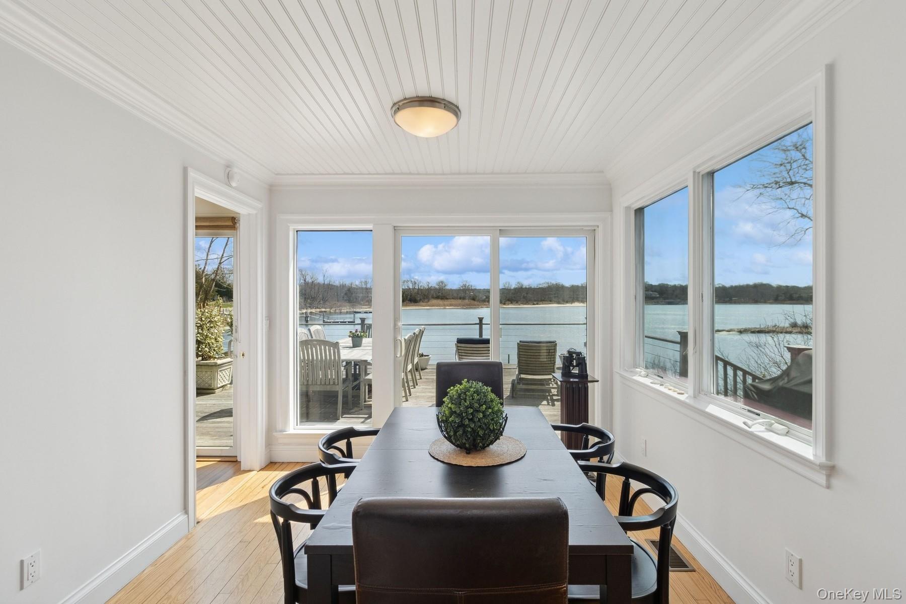80 Towd Point Road Southampton, NY 11968 - Photo 13 of 30 a living room with furniture and a window