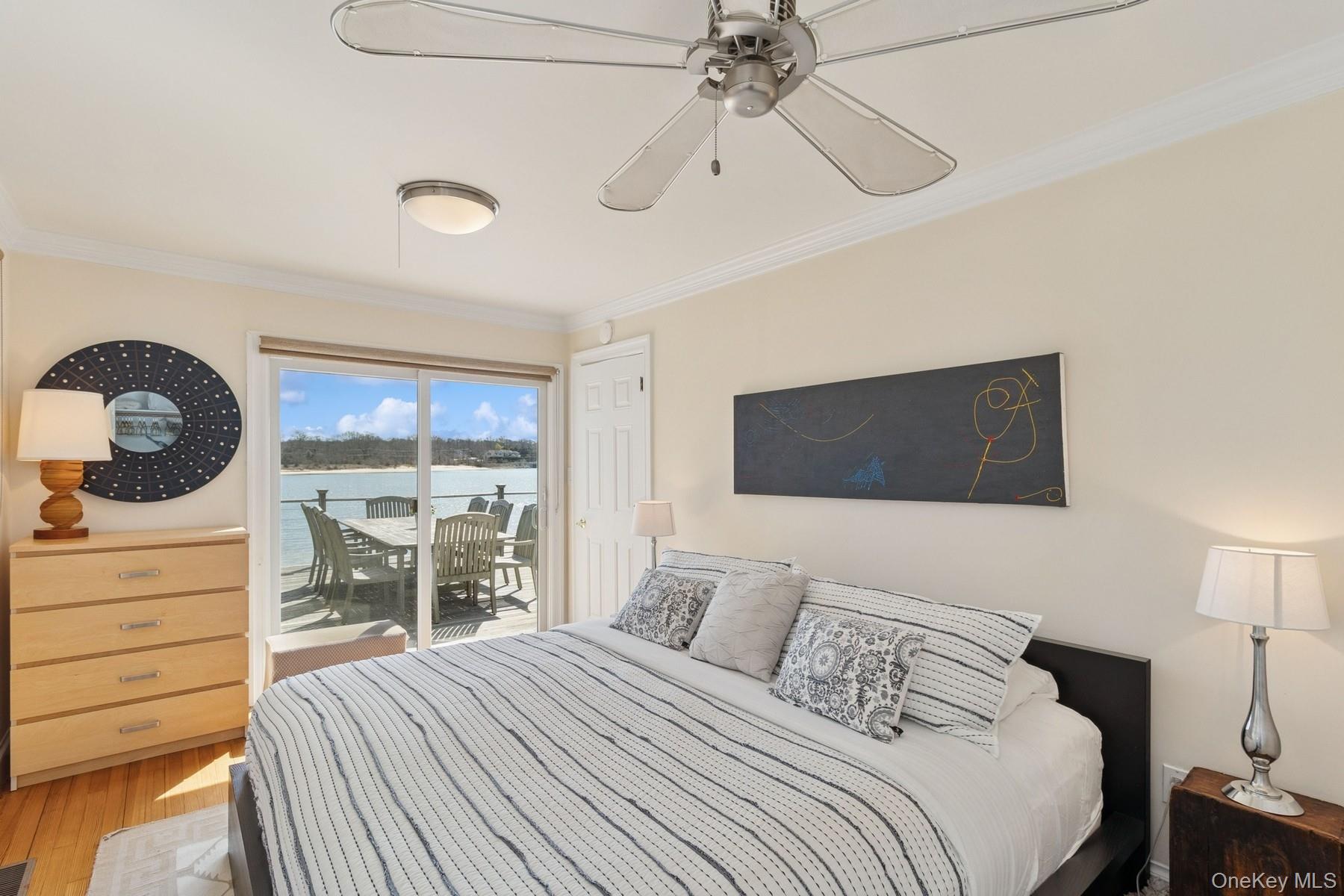 80 Towd Point Road Southampton, NY 11968 - Photo 17 of 30 a bedroom with a bed and a dresser