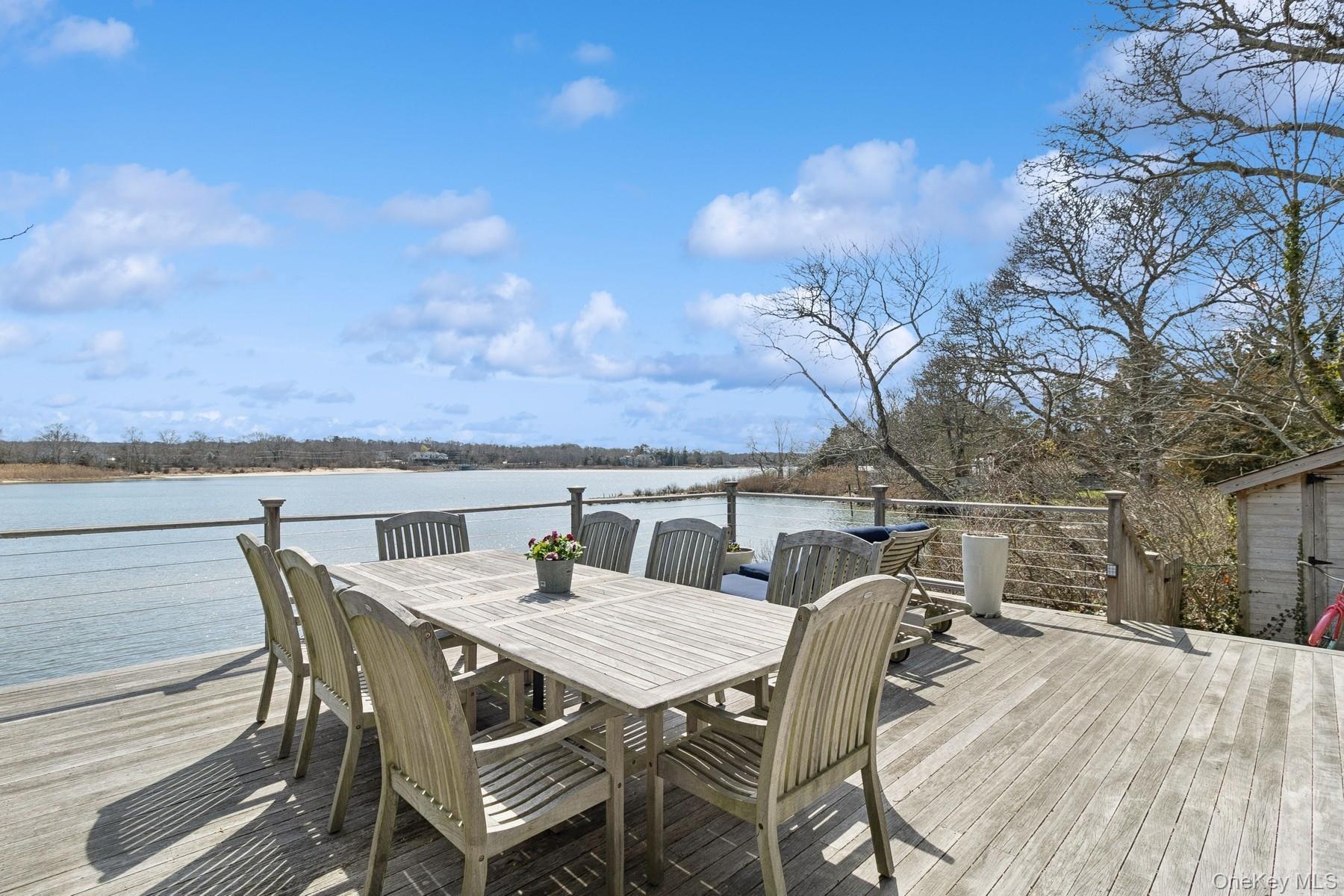 80 Towd Point Road Southampton, NY 11968 - Photo 25 of 30 a roof deck with a table and chairs
