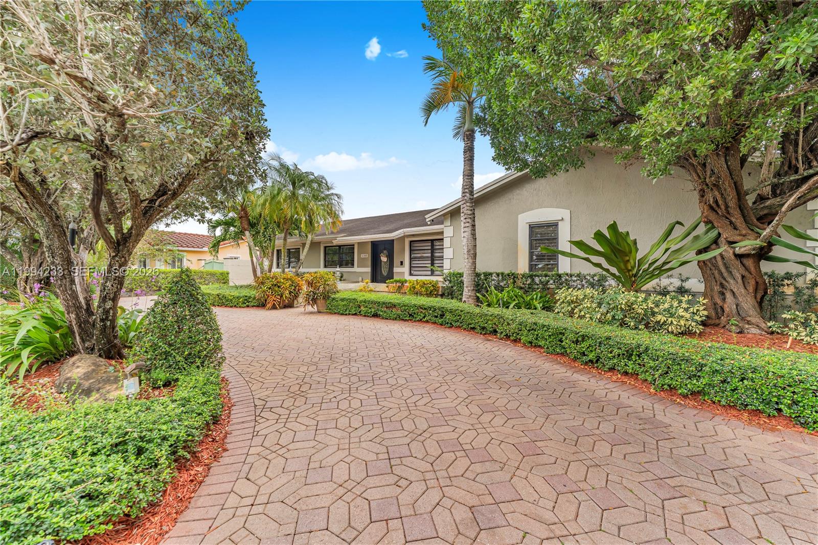 2385 Southwest 131st Place Miami, FL 33175 - Photo 13 of 39 a house with trees in front of it