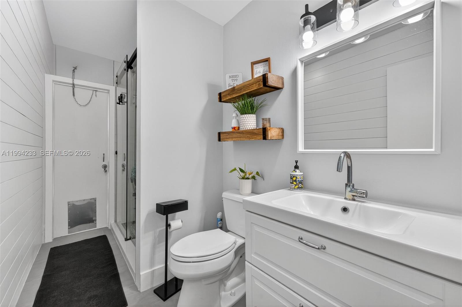 2385 Southwest 131st Place Miami, FL 33175 - Photo 16 of 39 a bathroom with a sink a toilet and shower