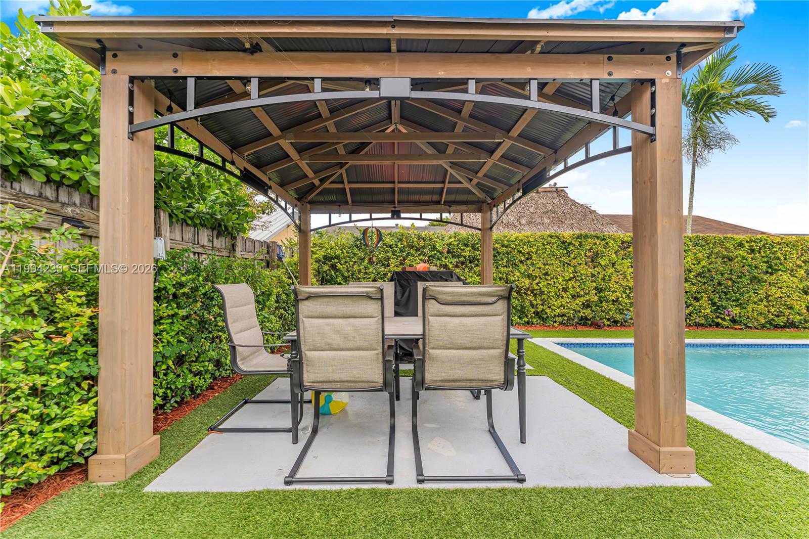 2385 Southwest 131st Place Miami, FL 33175 - Photo 21 of 39 a patio view with a seating space