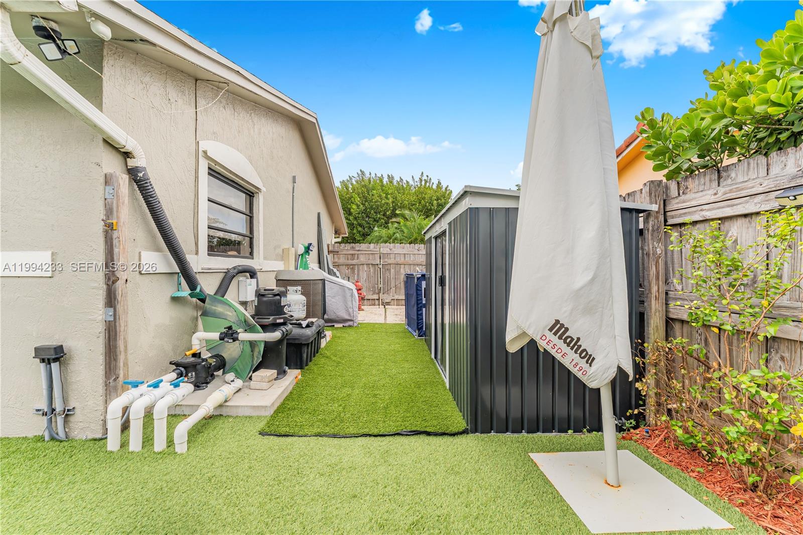 2385 Southwest 131st Place Miami, FL 33175 - Photo 22 of 39 a view of a porch with furniture and garden