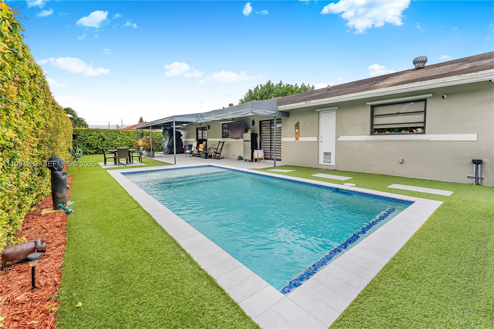 2385 Southwest 131st Place Miami, FL 33175 - Photo 24 of 39 a view of a house with swimming pool yard and patio