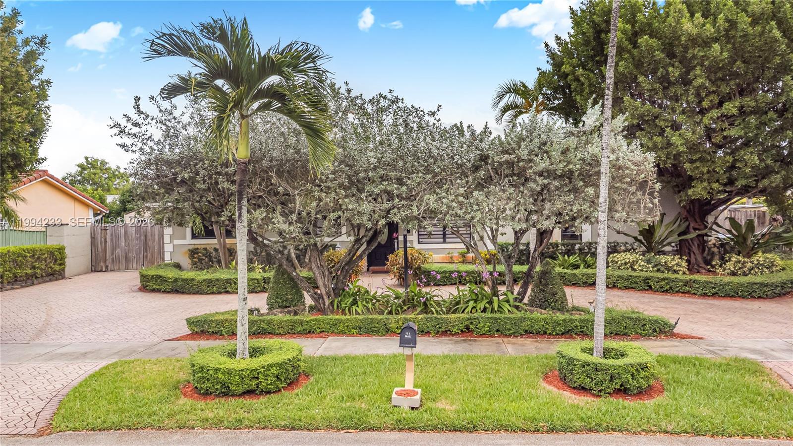 2385 Southwest 131st Place Miami, FL 33175 - Photo 35 of 39 a front view of a house with a yard