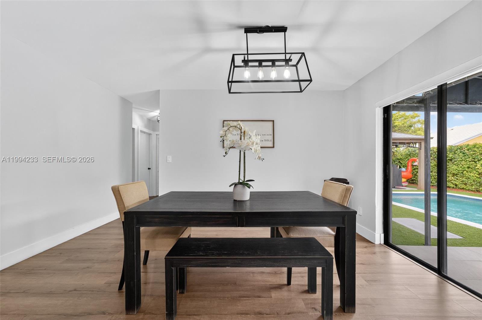 2385 Southwest 131st Place Miami, FL 33175 - Photo 5 of 39 a view of a workspace with furniture and wooden floor