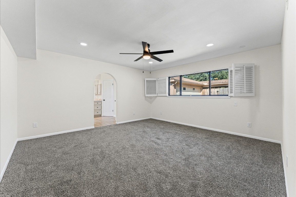 5634 Jason Street Houston, TX 77096 - Photo 20 of 25 an empty room with ceiling fan and windows