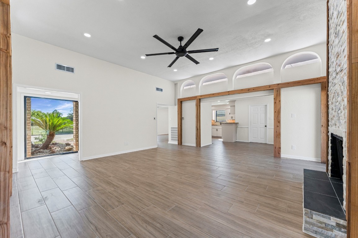 5634 Jason Street Houston, TX 77096 - Photo 8 of 25 a view of empty room with wooden floor and fan