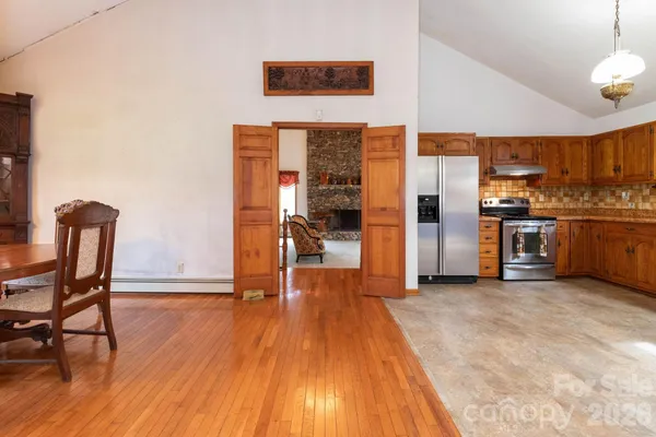 a kitchen with stainless steel appliances granite countertop a stove and a refrigerator