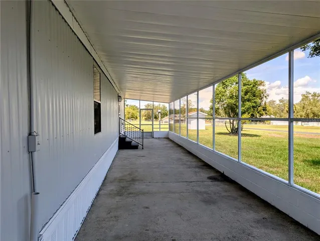a view of hallway with a large window