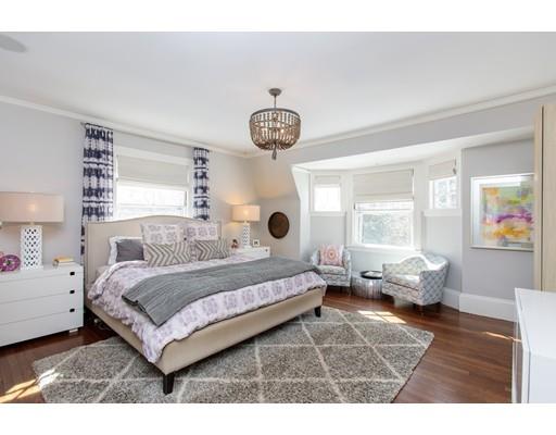 102 Abbott Road Wellesley, MA 02481 - Photo 16 of 21 a bedroom with a bed and wooden floor