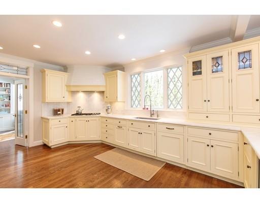 102 Abbott Road Wellesley, MA 02481 - Photo 9 of 21 a kitchen with granite countertop white cabinets and white appliances