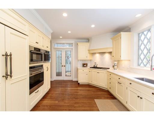 102 Abbott Road Wellesley, MA 02481 - Photo 10 of 21 a kitchen with stainless steel appliances kitchen island granite countertop a stove top oven a sink and a refrigerator