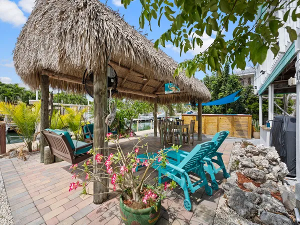 a bathroom with a toilet a sink and a mirror
