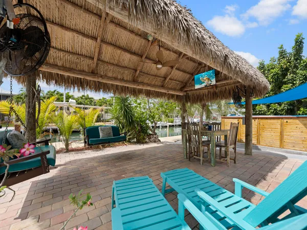 a view of an chairs and table in a room