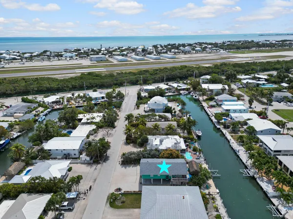 an aerial view of a city with ocean view