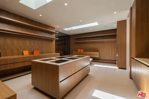 a stove top oven sitting inside of a kitchen
