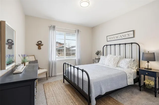 a bedroom with a bed and a table