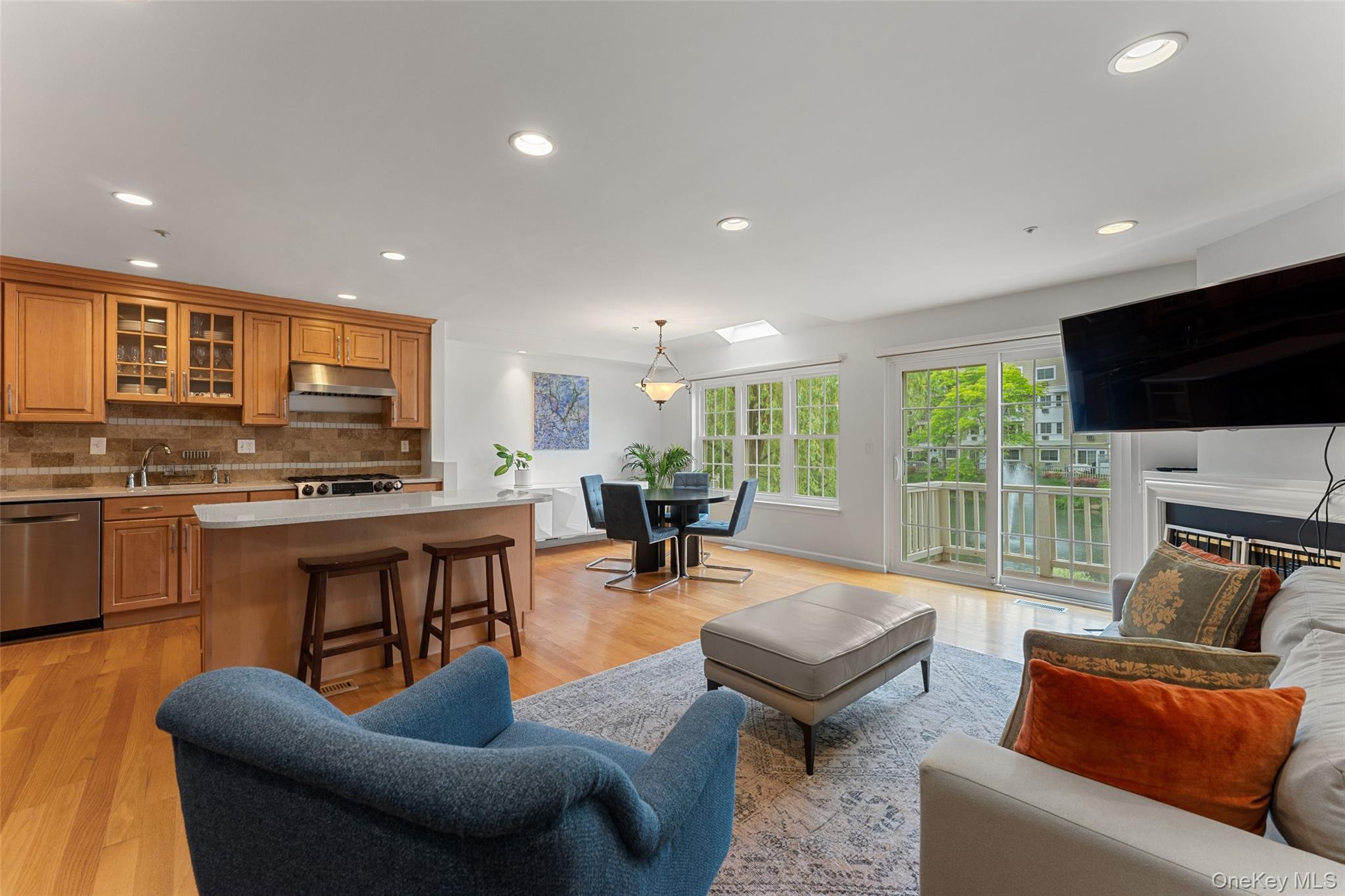 611 Pondside Drive White Plains, NY 10607 - Photo 2 of 40 Open-concept living area facing outside pond