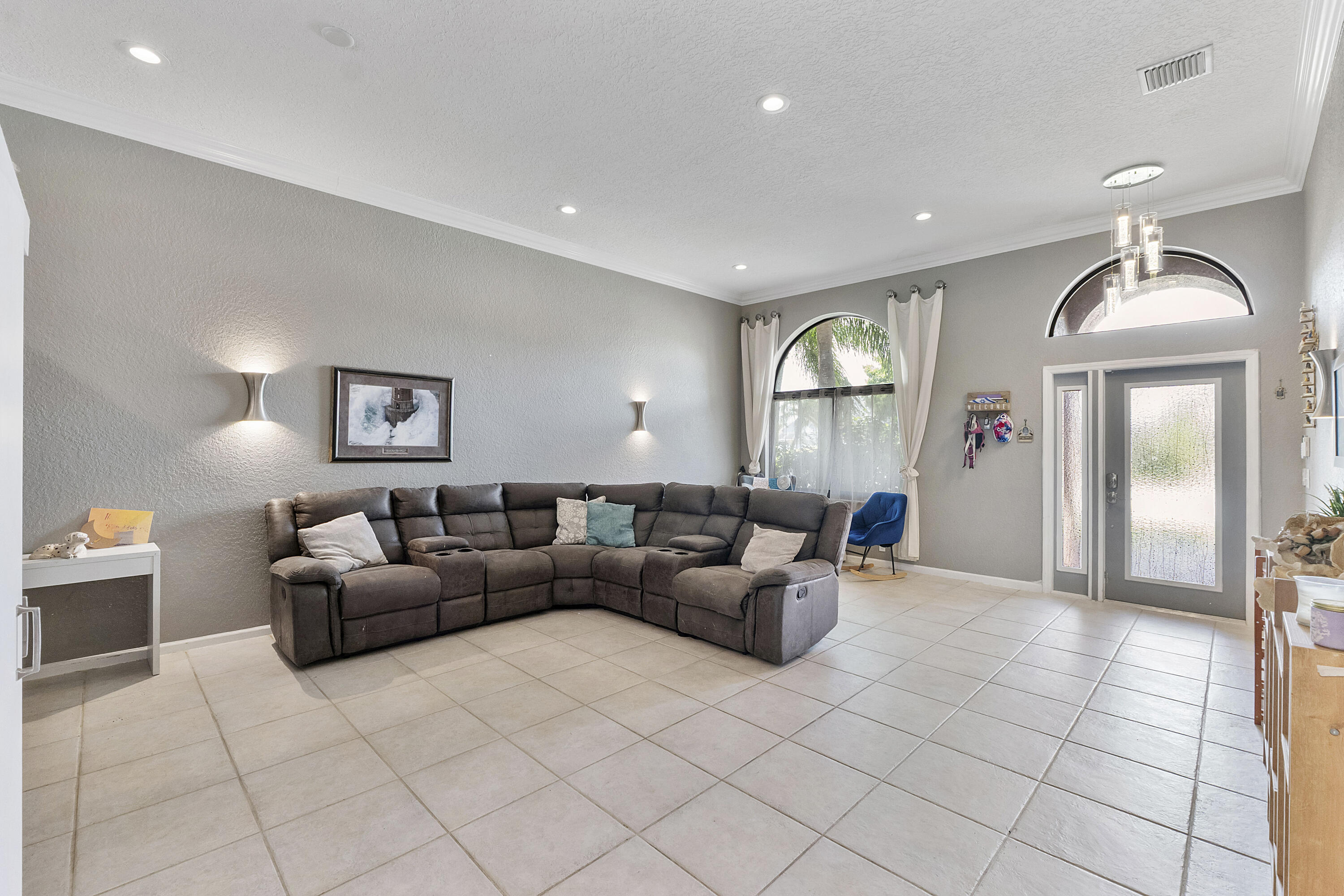 12328 St Simon Drive Boca Raton, FL 33428 - Photo 8 of 52 a living room with furniture and a window