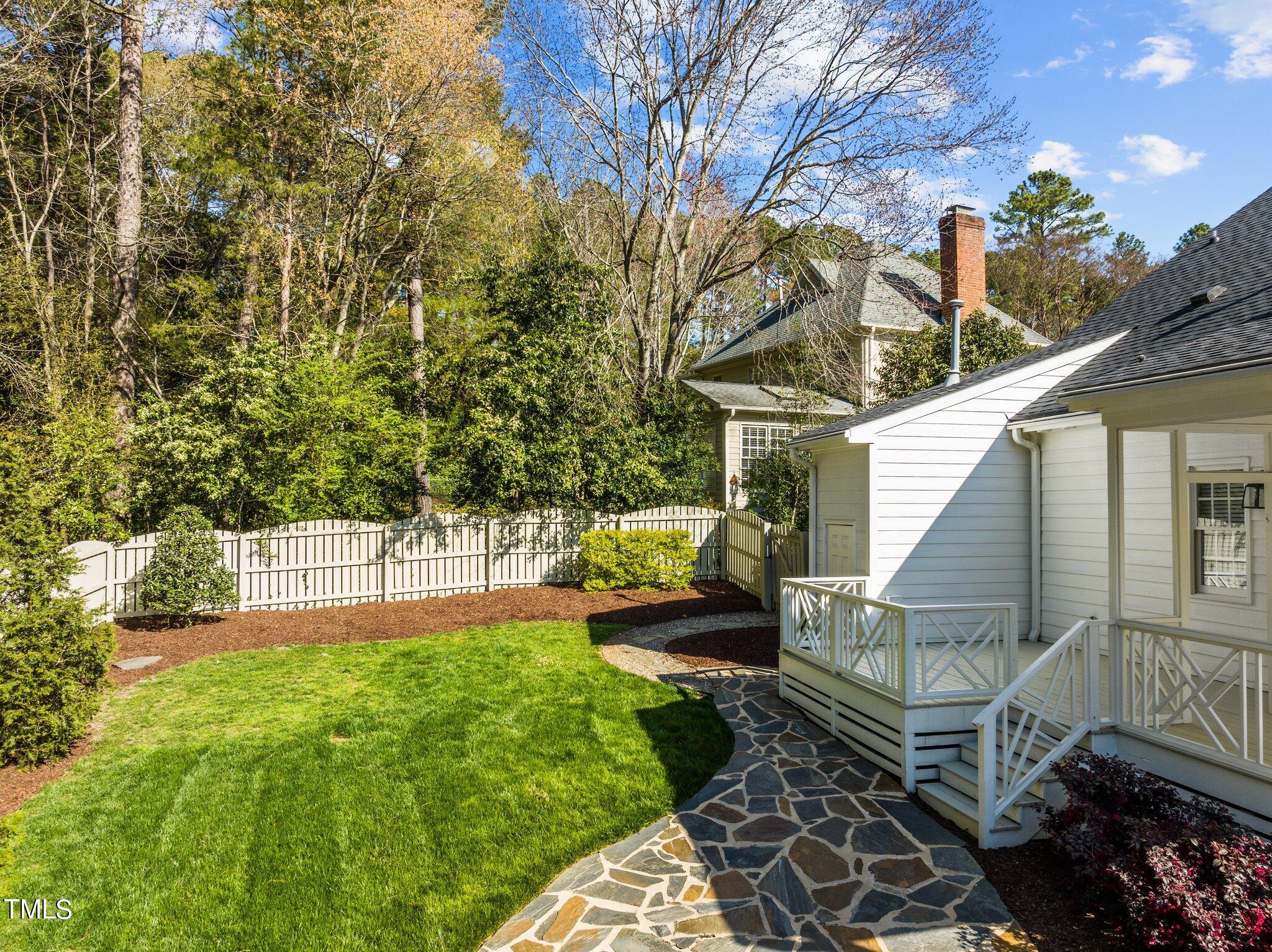 7625 Pinewild Court Raleigh, NC 27615 - Photo 27 of 41 a view of a backyard with sitting area