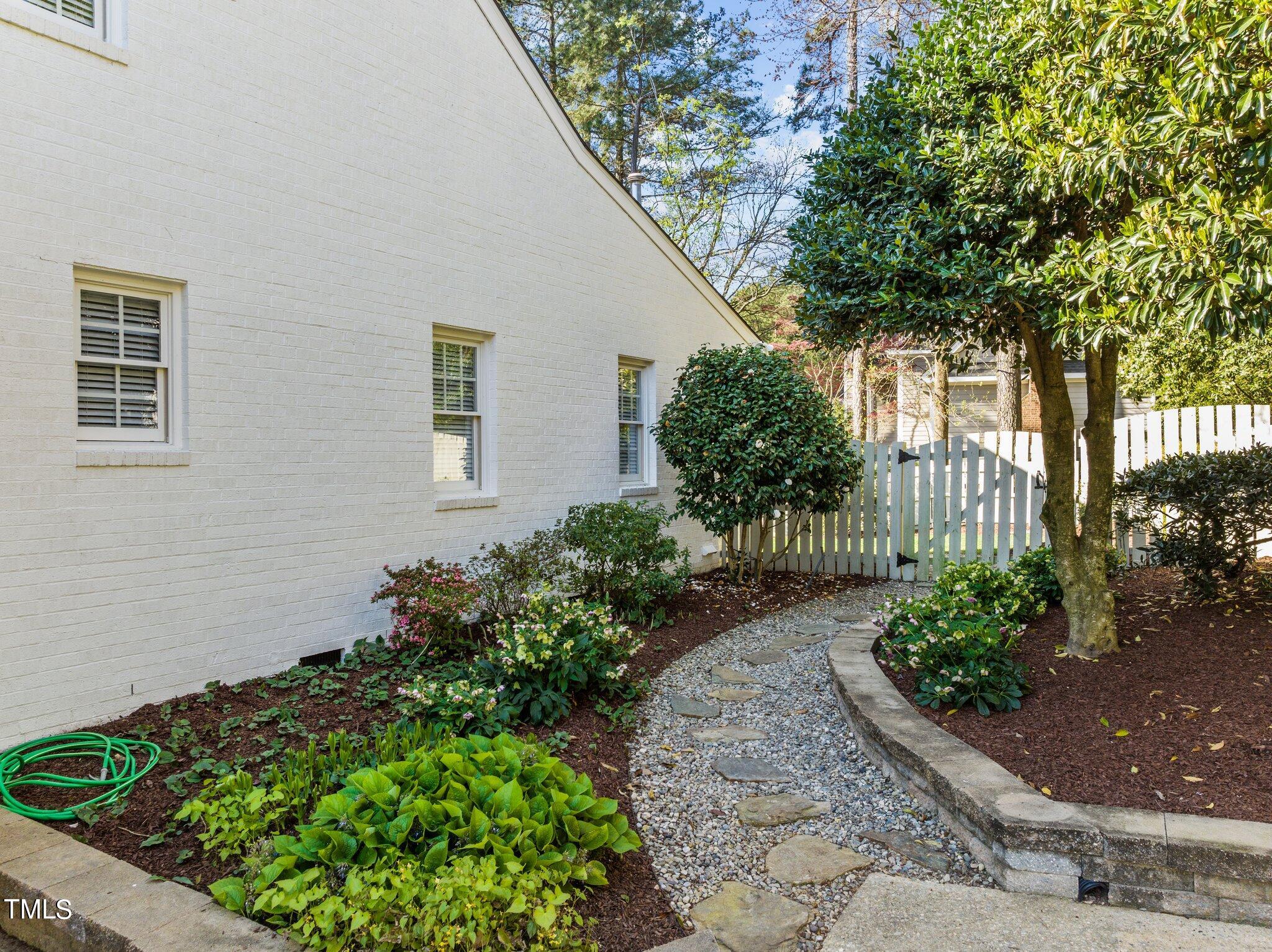 7625 Pinewild Court Raleigh, NC 27615 - Photo 5 of 41 a front view of a house with a yard