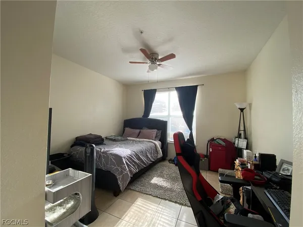a bedroom with bed and a window