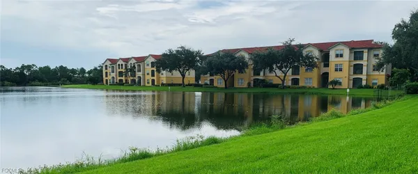 a view of a lake with a house in the background